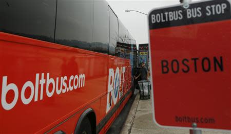 A passenger boards a Boltbus bus in New York City May 8, 2014. REUTERS/Eduardo Munoz