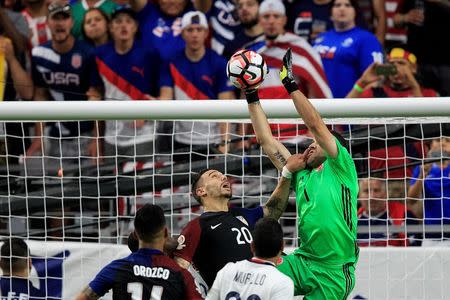Jun 25, 2016; Glendale, AZ, USA; United States defender Geoff Cameron (20) hits Colombia goalkeeper David Ospina (1) as he makes a save in the second half against during the third place match of the 2016 Copa America Centenario soccer tournament at University of Phoenix Stadium. Columbia beat the United States 1-0. Mandatory Credit: Allan Henry-USA TODAY Sports