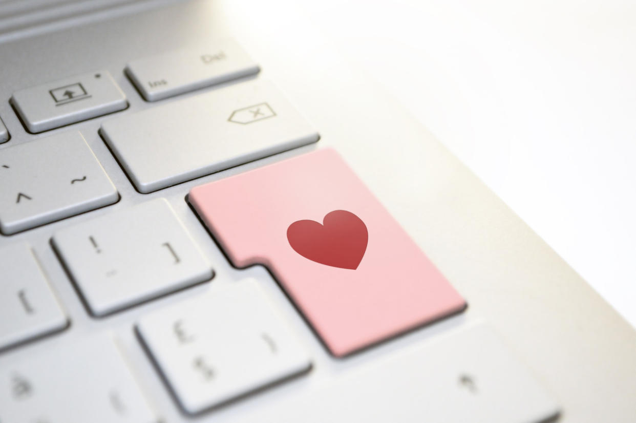  Computer keyboard with heart on large key. . 