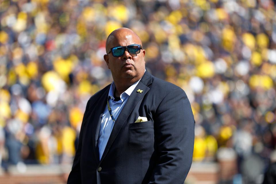 FILE - In this Sept. 7, 2019, file photo, Michigan athletic director Warde Manue watches the team's NCAA college football game against Army in Ann Arbor, Mich. The university and Manuel have agreed on a five-year contract extension, shortly after the head of the department negotiated a new deal with football coach Jim Harbaugh. (AP Photo/Paul Sancya, File)