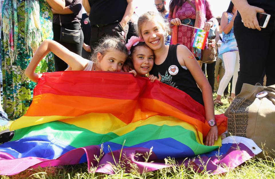 Cousins Hope Voigt, Mathilda Bowman and Rory Voigt are part of the crowd in Sydney. (Photo: Don Arnold via Getty Images)