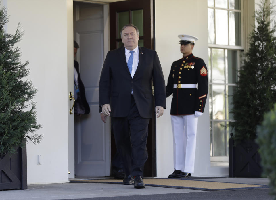 Secretary of State Mike Pompeo walks out of the White House to talk to the media after briefing President Donald Trump in the Oval Office, Thursday, Oct. 18, 2018, in Washington. (AP Photo/Evan Vucci)