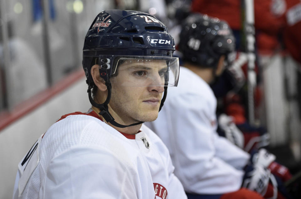 Washington Capitals' Nic Dowd sits on the bench before taking the ice at NHL hockey training camp, Friday, Sept. 14, 2018, in Arlington, Va. (AP Photo/Nick Wass)