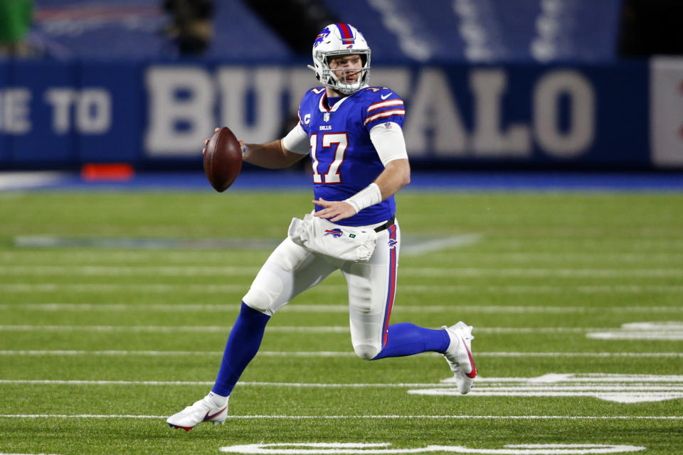 Buffalo Bills' Josh Allen (17) rushes during the first half of an NFL divisional round football game against the Baltimore Ravens Saturday, Jan. 16, 2021, in Orchard Park, N.Y. (AP Photo/Jeffrey T. Barnes)