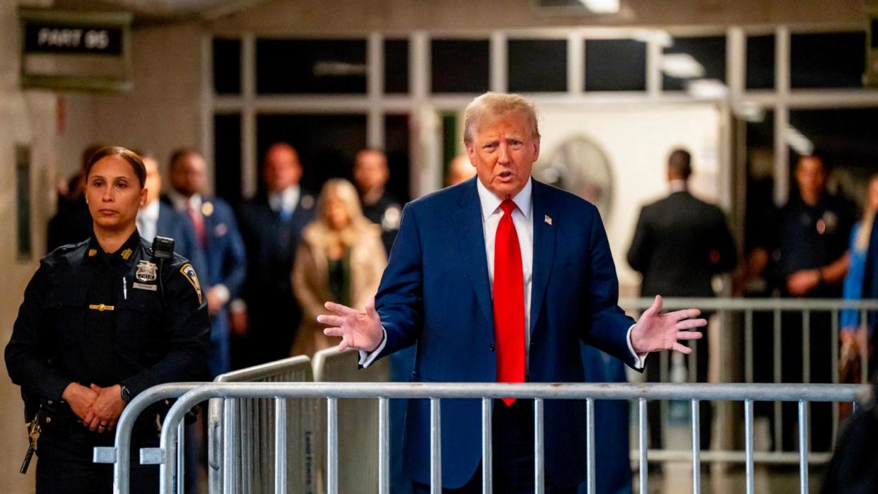 PHOTO: Former President Donald Trump speaks to the press as he arrives for his trial for allegedly covering up hush money payments linked to extramarital affairs, at Manhattan Criminal Court in New York City, Apr. 25, 2024. (Mark Peterson/AFP via Getty Images)