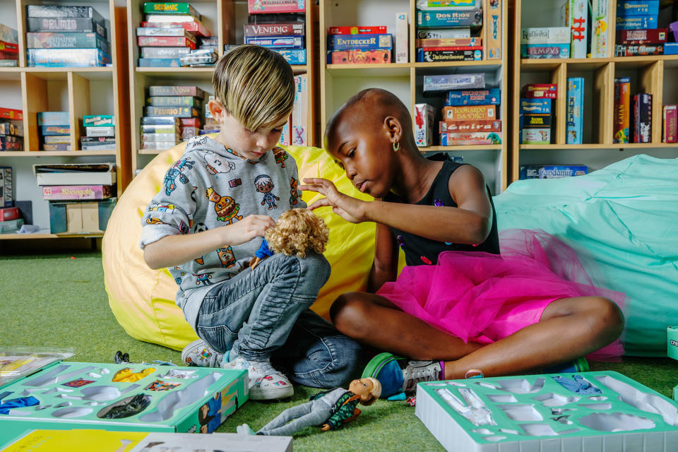 Shi’a, left, and Jhase play with Mattel’s gender-neutral doll | Photograph by Angie Smith for TIME.