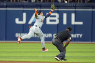 Detroit Tigers shortstop Javier Baez can't reacha single by Tampa Bay Rays' Isaac Paredes during the third inning of a baseball game Wednesday, April 24, 2024, in St. Petersburg, Fla. (AP Photo/Chris O'Meara)