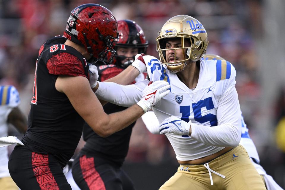 Sep 9, 2023; San Diego, California, USA; UCLA Bruins defensive lineman Laiatu Latu (15) battles against San Diego State Aztecs tight end Mark Redman (81) during the first half at Snapdragon Stadium. Mandatory Credit: Orlando Ramirez-USA TODAY Sports