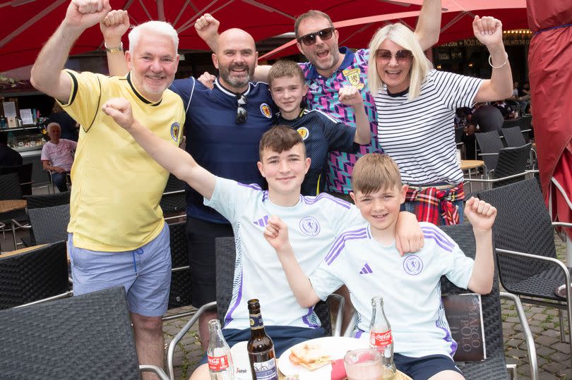 Tony Scott, David Wiszniewski and Ewan Currie, Vivien Emery with kids Ewan Currie and brothers Rory and Sam