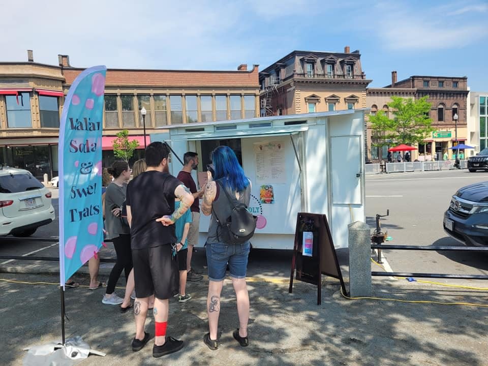 Thirsty visitors line up at The Friendly Fizz for some Italian soda on Taunton Green at the second annual Downtown Art Jam on Saturday, May 21, 2022.