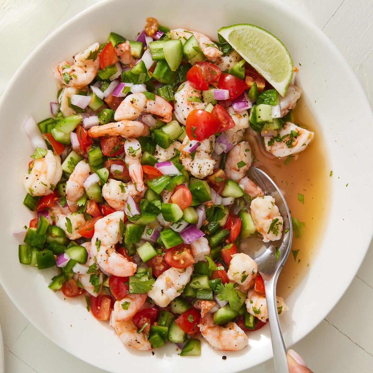 shrimp ceviche with tomatoes, cucumbers and red onion