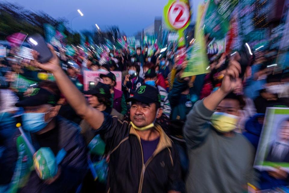 The supporters of Democratic Progressive Party (DPP) cheer at an election campaign on January 12, 2024 in Tainan, Taiwan.