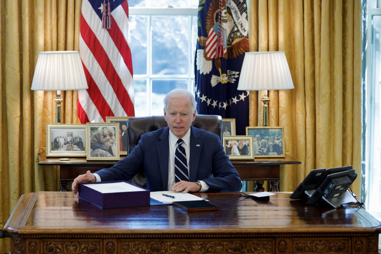 U.S. President Joe Biden looks on after signing the American Rescue Plan, a package of economic relief measures to respond to the impact of the coronavirus disease (COVID-19) pandemic, inside the Oval Office at the White House in Washington, U.S., March 11, 2021. REUTERS/Tom Brenner