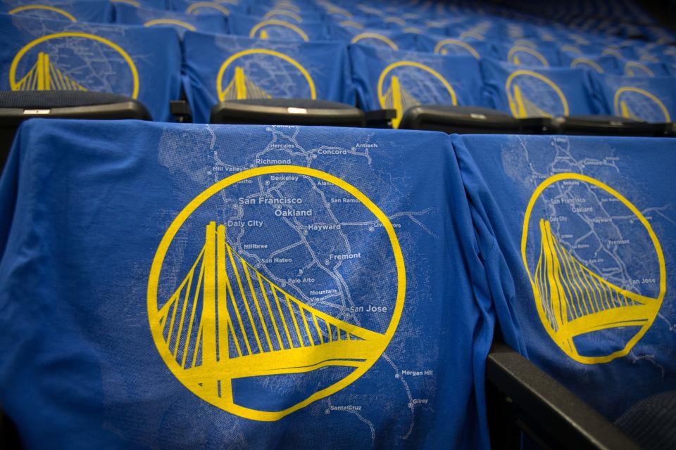 T-shirts depict a map of the bay area and the Golden State Warriors logo .