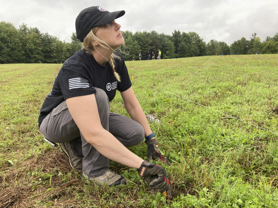 Veteran Megan Lukaszeski takes part in an archaeological dig at the site of the Second Battle of Saratoga, Thursday, Sept. 9, 2021, in Stillwater, N.Y. Veterans with American Veterans Archaeological Recovery are searching for Revolutionary War artifacts at the Saratoga National Historical Park this month. (AP Photo/Michael Hill)