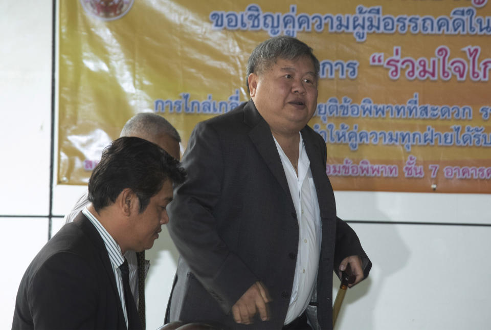 In this Wednesday, Aug. 14, 2019, photo, Thai business tycoon president of Italian-Thai Development Premchai Karnasuta arrives at the Bangkok Criminal Court in Bangkok, Thailand. Premchai was sentenced by the court to six months in prison for illegal possession for illegal possession of a firearm, which follows convictions on other charges related to his arrest last year when he and several of his employees were found in a state wildlife sanctuary with guns and the carcasses of a black panther and other animals in an alleged case of poaching. (AP Photo/Sakchai Lalit)