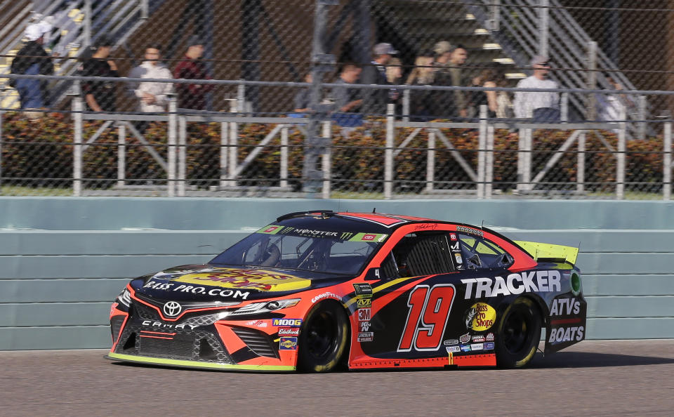 Martin Truex Jr. drives on the front stretch during a NASCAR Cup Series auto race on Sunday, Nov. 17, 2019, at Homestead-Miami Speedway in Homestead, Fla. Truex is one of four drivers running for the championship. (AP Photo/Terry Renna)