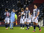 West Bromwich Albion players react after Manchester City's Joao Cancelo scoring his side's second goal during the English Premier League soccer match between West Bromwich Albion and Manchester City at the Hawthorns stadium in West Bromwich, England, Tuesday, Jan. 26, 2021. (Michael Regan/Pool via AP)