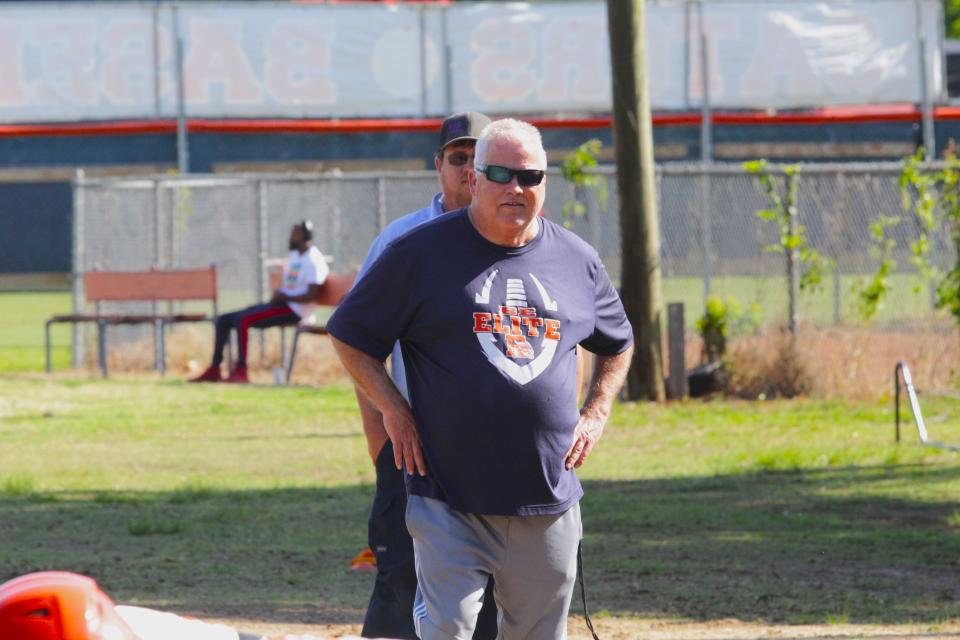 Escambia football head coach Mike Bennett keeps an eye on practice during the Gators' first week of spring practices on Tuesday, April 30, 2024.