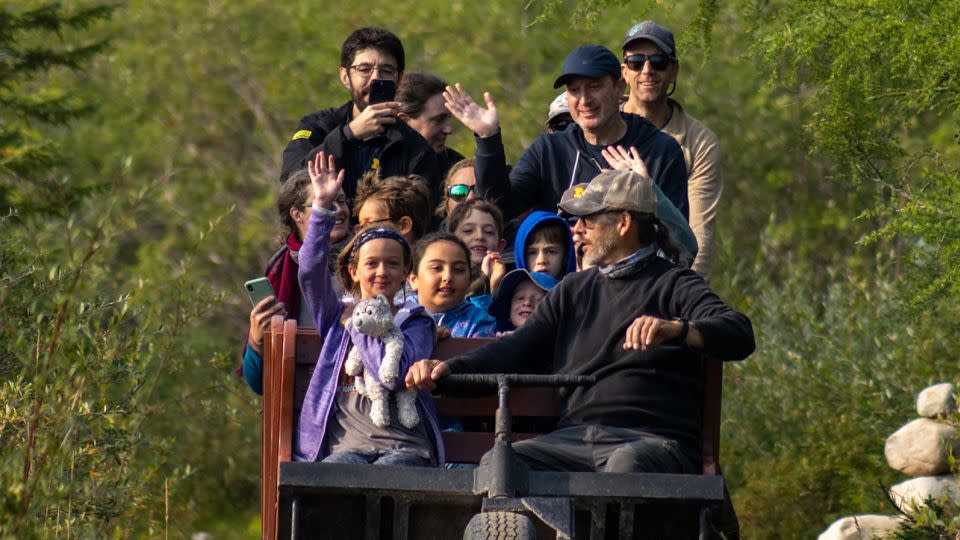 Visitors take a summertime ride behind sled dogs with Wapusk Adventures in Churchill. - Alex Cupeiro/Fronters North Adventures