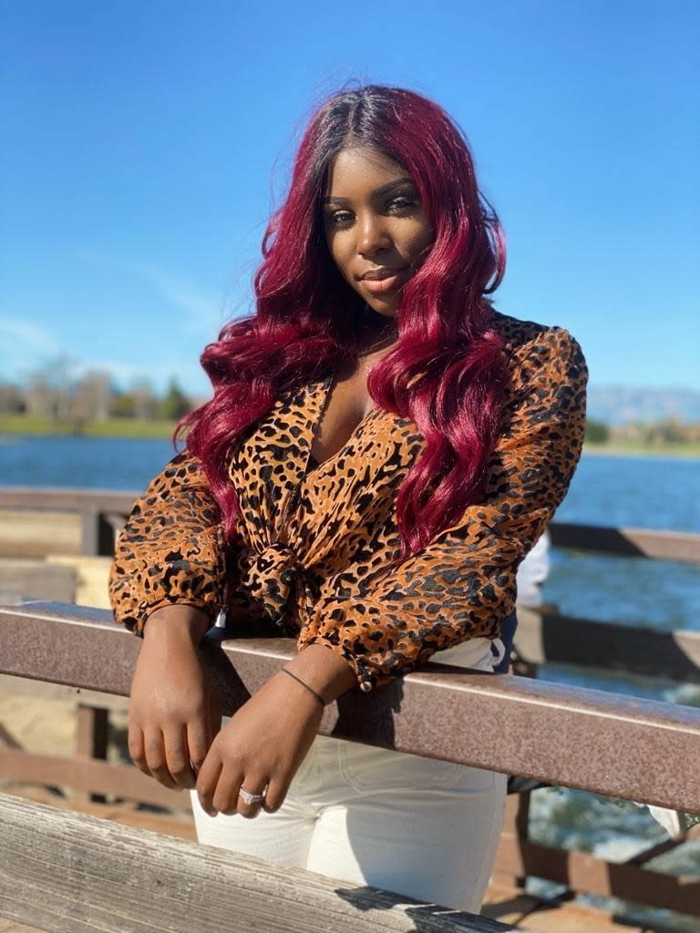 Sarah Palafox, an African American woman who sings regional Mexican music, poses in Moreno Valley, Calif., in this undated photo. Palafox, who goes by the name Sarah La Morena, was born in Southern California but raised in the Mexican state of Zacatecas. The 23-year-old has sparked many emotions following a series of viral video performances on social media. (Edward "E-Dub" Rios/Silent Giant Entertainment via AP)