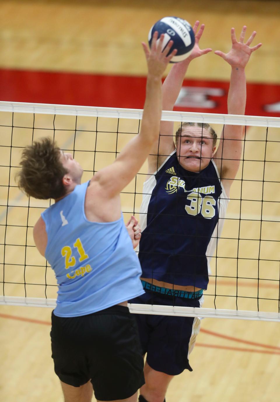 Salesianum's Reid Maas (right) blocks against Cape Henlopen's Dylan Henry in the first game of Cape Henlopen's 3-0 win for the first DIAA state title earned in boys volleyball, Tuesday, May 23, 2023 at Smyrna High School.