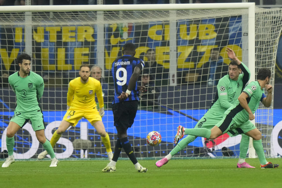 Inter Milan's Marcus Thuram shoots during the Champions League, round of 16, first leg soccer match between Inter Milan and Atletico Madrid, at the San Siro stadium in Milan, Italy, Tuesday, Feb. 20, 2024. (AP Photo/Luca Bruno)