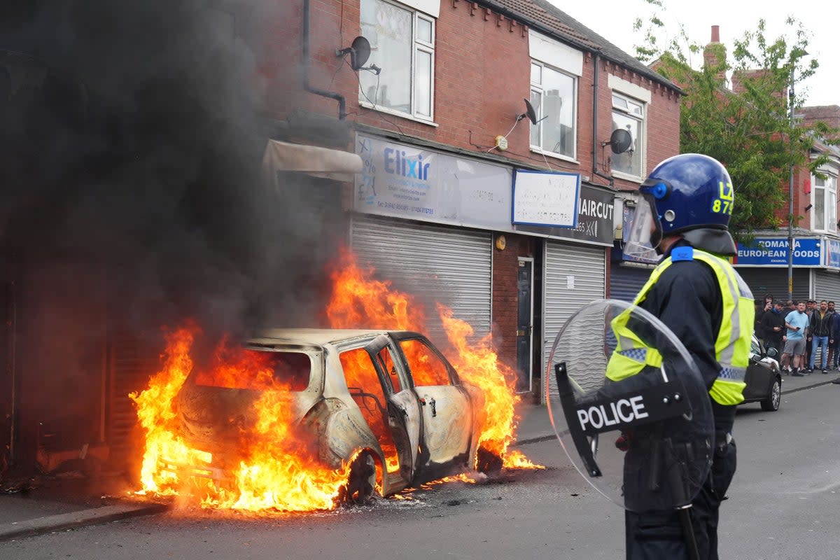 A car burns in Middlesbrough, during an anti-immigration protest (PA Wire)