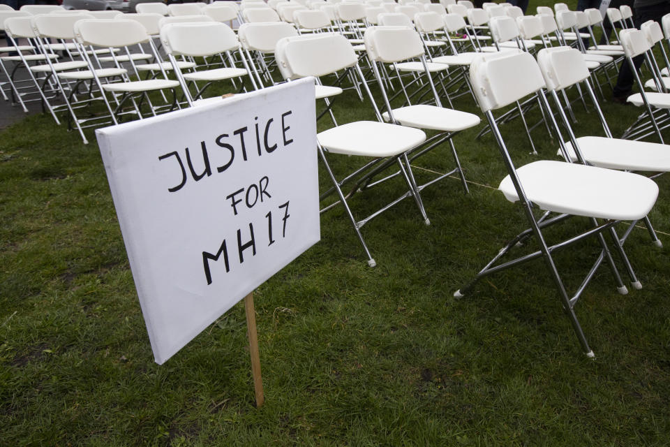 298 empty chairs, each chair for one of the 298 victims of the downed Malaysia Air flight MH17, are placed in a park opposite the Russian embassy in The Hague, Netherlands, Sunday, March 8, 2020. A missile fired from territory controlled by pro-Russian rebels in Ukraine in 2014, tore the MH17 passenger jet apart killing all 298 people on board. United by grief across oceans and continents, families who lost loved hope that the trial which starts Monday March 9, 2020, will finally deliver them something that has remained elusive ever since: The truth. (AP Photo/Peter Dejong)