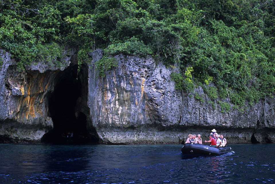 A group of tourists explore a cave in Tonga. Source: Getty