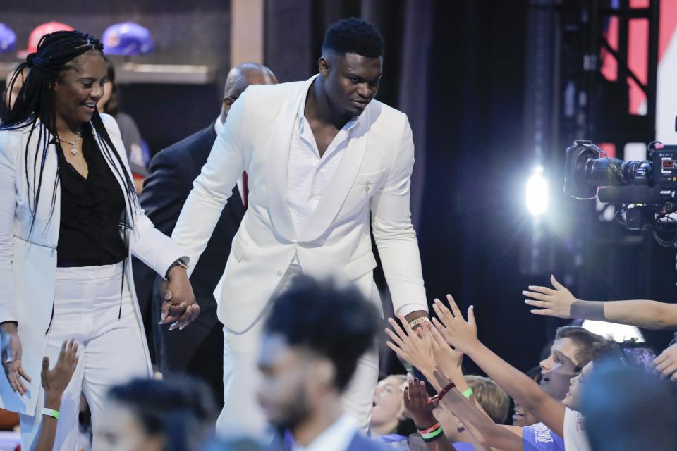 Duke's Zion Williamson greets fans as he is introduced during the NBA basketball draft Thursday, June 20, 2019, in New York. (AP Photo/Julio Cortez)