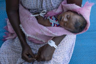 Terhas Tsfa, 25, who gave birth on a street as she fled the conflict in Ethiopia's Tigray region, holds her baby at Um Rakuba refugee camp in Qadarif, eastern Sudan, Monday, Nov. 23, 2020. Ethiopia's government is again warning residents of the besieged capital of the embattled Tigray region as the clock ticks on a 72-hour ultimatum before a military assault, saying "anything can happen." (AP Photo/Nariman El-Mofty)