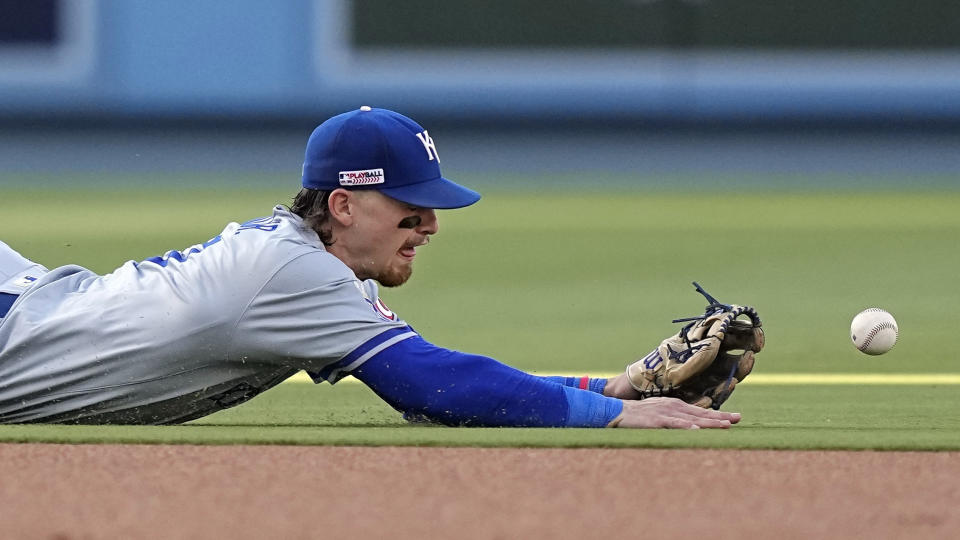 Kansas City Royals shortstop Bobby Witt Jr. can't get to a ball hit for a single by Los Angeles Dodgers' Mookie Betts during the first inning of a baseball game Saturday, June 15, 2024, in Los Angeles. (AP Photo/Mark J. Terrill)