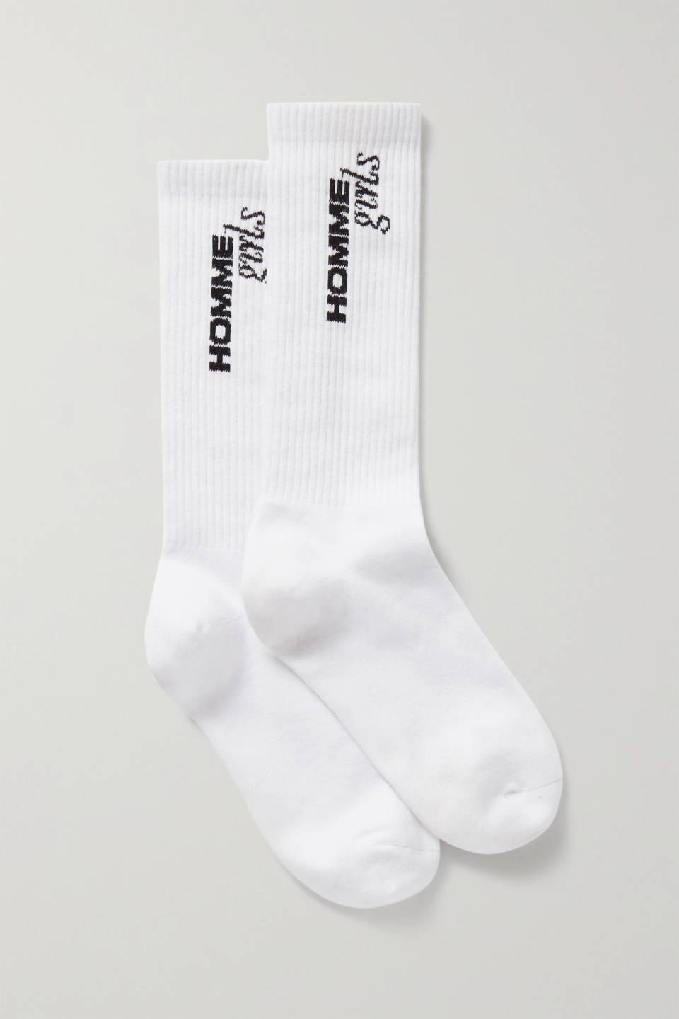 <h2>Hommegirls Ribbed Socks</h2><br>For those who like to wear their sandals with tube socks. These ones are from Thakoon Panichgul’s new brand, Hommegirls, which also includes a <a href="https://www.hommegirls.com/products/copy-of-copy-of-volume-6-lily-rose-depp" rel="nofollow noopener" target="_blank" data-ylk="slk:quarterly magazine" class="link rapid-noclick-resp">quarterly magazine</a> (this season, done in collaboration with Chanel). <br><br><strong>Hommegirls</strong> Intarsia Ribbed Stretch Cotton-Blend Socks, $, available at <a href="https://go.skimresources.com/?id=30283X879131&url=https%3A%2F%2Fwww.net-a-porter.com%2Fen-us%2Fshop%2Fproduct%2Fhommegirls%2Flingerie%2Fsocks%2Fintarsia-ribbed-stretch-cotton-blend-socks%2F9649229528823354" rel="nofollow noopener" target="_blank" data-ylk="slk:Net-A-Porter" class="link rapid-noclick-resp">Net-A-Porter</a>