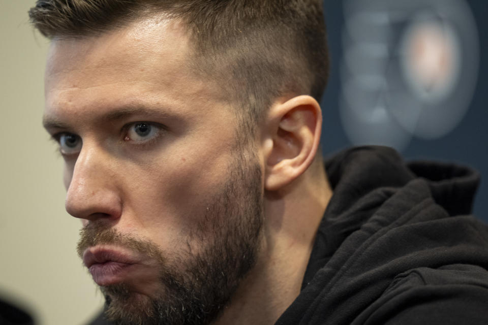 Philadelphia Flyers' Ivan Fedotov takes questions from the media during an NHL hockey press conference, Friday, March 29, 2024, in Voorhees, N.J. Nine years after he was drafted by Philadelphia, goalie Ivan Fedotov has joined the Flyers.(AP Photo/Chris Szagola)