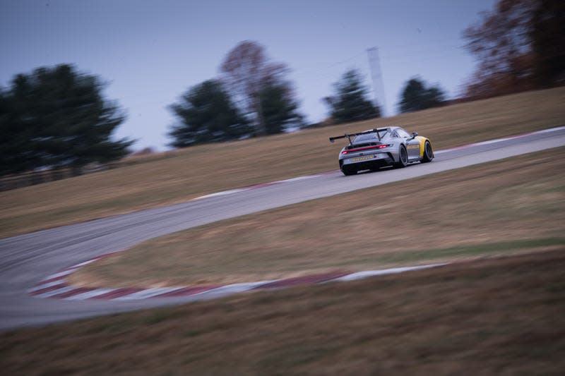 The Porsche 992 hot on the track in Indianapolis.