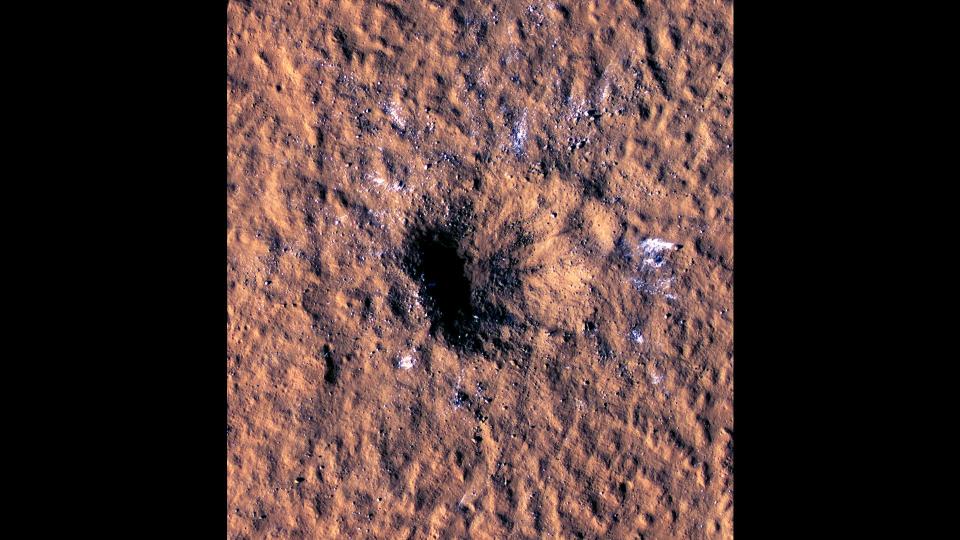 The High-Resolution Imaging Science Experiment (HiRISE camera) aboard NASA's Mars Reconnaissance Orbiter imaged boulder-size blocks of water ice around the rim of a meteoroid impact crater on Mars. The crater was formed in December 2021 in a region of Mars called Amazonis Planitia, the closest to the Martian equator that buried water ice has ever been found.