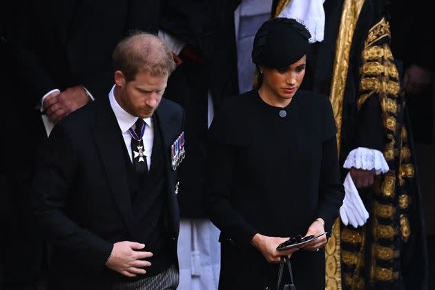 The Duke of Sussex and Duchess of Sussex leave after a service for the reception of Queen Elizabeth II's coffin at Westminster Hall. (Photo: BEN STANSALL via Getty Images)