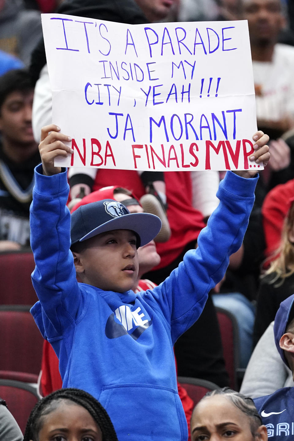 A Memphis Grizzlies fan holds a sign for guard Ja Morant during the first half of an NBA basketball game against the Chicago Bulls in Chicago, Sunday, April 2, 2023. (AP Photo/Nam Y. Huh)