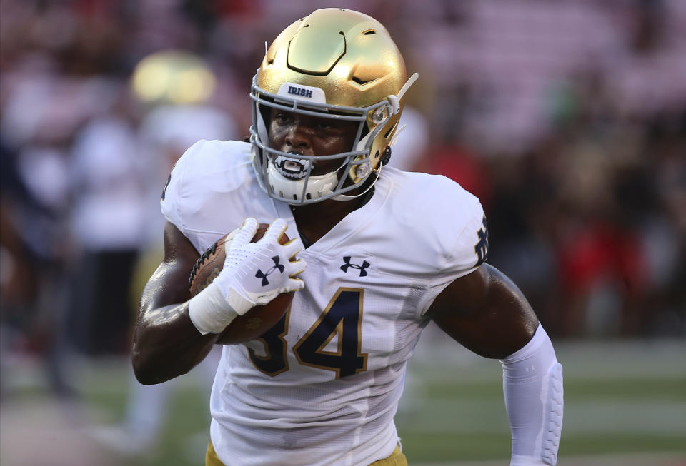 FILE - Notre Dame Jahmir Smith runs during an NCAA football game on Monday, Sept. 2 , 2019, in Louisville, Ky. With all the success Notre Dame has enjoyed its last three seasons, amassing a 33-6 record under coach Brian Kelly, it has been the inability to run the football successfully in big games that has curtailed the championship hopes of the Fighting Irish. No. 10 Notre Dame hopes to change that starting Saturday when Duke visits for the 2020 season opener. (AP Photo/Tony Tribble, File)