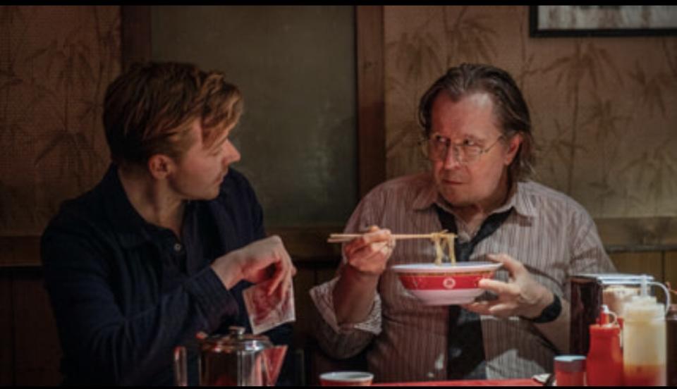 (L-R) Jack Lowden’s 007 wannabe River Cartwright dines with his boss Jackson lamb (Gary Oldman) in ‘Slow Horses’