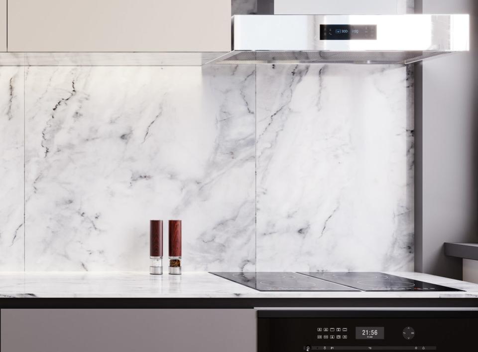 kitchen with a marble counter and backsplash