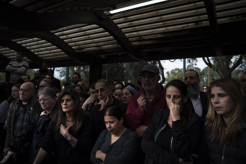 Family and friends of Israeli reservist Yair Cohen attend his funeral at Kiryat Shaul military cemetery in Tel Aviv, Israel, Tuesday, Feb. 13, 2024. Cohen, 30, was killed during Israel's ground operation in the Gaza Strip, where the Israeli army has been battling Palestinian militants in the war ignited by Hamas' Oct. 7 attack into Israel. (AP Photo/Oded Balilty)