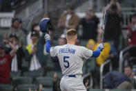 Los Angeles Dodgers' Freddie Freeman acknowledges the crowd as he steps to the plate to bat in the first inning of a baseball game against the Atlanta Braves, Monday, May 22, 2023, in Atlanta. Freeman formerly played for the Braves. (AP Photo/John Bazemore)