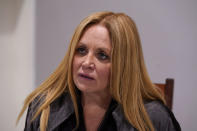 Republican Women’s Federation of Michigan Vice President Londa Gatt speaks during an interview at her home outside of Detroit on Wednesday, Feb. 17, 2021. In mid-February, she said the FBI knocked on her door to ask where she was on Jan. 6. She says she climbed the scaffolding outside the Capitol building in Washington “to take a picture of the whole view.” And she said she gladly told the agents that she did nothing wrong, and left the scene as things turned violent. (AP Photo/Carlos Osorio)