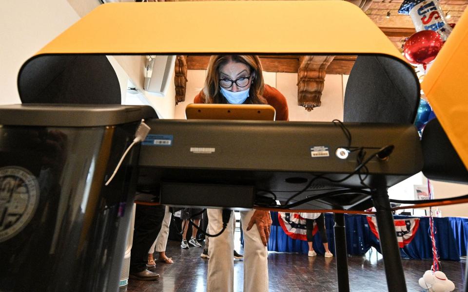 Caitlyn Jenner casting her ballot on Tuesday. The reality TV star is among an eclectic field of candidates - GETTY IMAGES