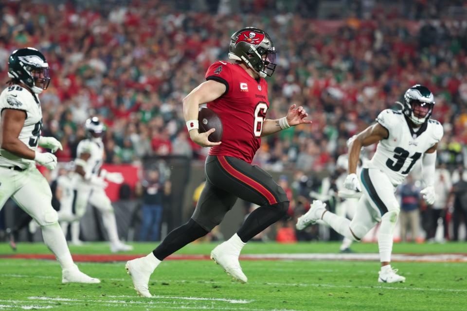 Jan 15, 2024; Tampa, Florida, USA; Tampa Bay Buccaneers quarterback Baker Mayfield (6) runs with the ball against the Philadelphia Eagles during the first half of a 2024 NFC wild card game at Raymond James Stadium. Mandatory Credit: Kim Klement Neitzel-USA TODAY Sports