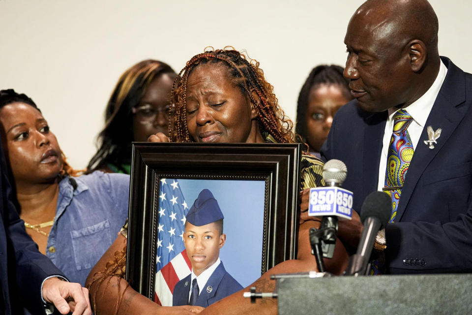 Chantemekki Fortson, mother of Roger Fortson, holds a photo of her son. (Gerald Herbert / AP)