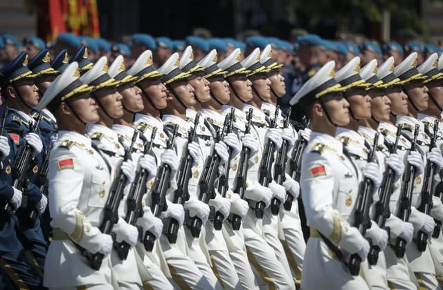 Soldiers from China’s People’s Liberation Army march (Pavel Golovkin/AP)