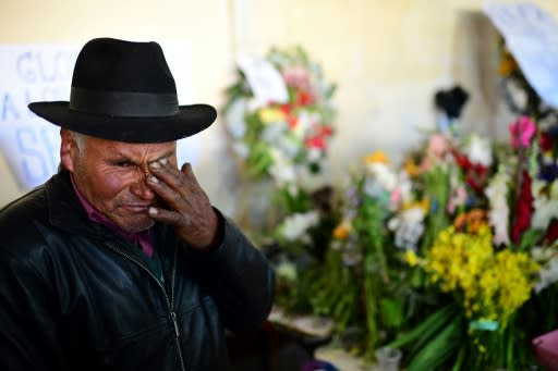 A man mourns during the funeral for five supporters of Bolivia's ex-president Evo Morales, killed when security forces lifted a siege on a fuel plant, in El Alto on November 21, 2019